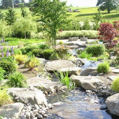 Natural Stream with waterfall in landscaped backyard in Tacoma