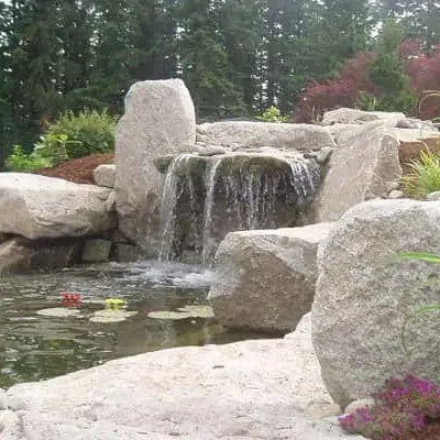 Natural stone waterfall in backyard in Seattle