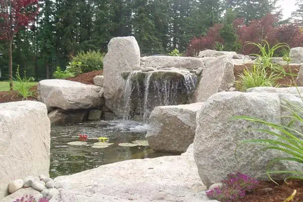 Natural stone waterfall in backyard in Seattle