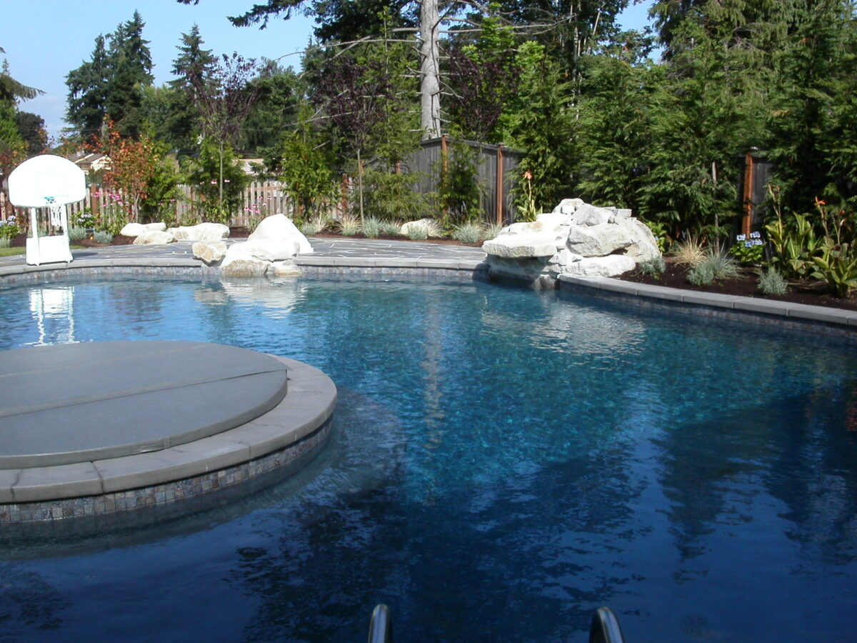 Rock installation around pool for a natural landscape design