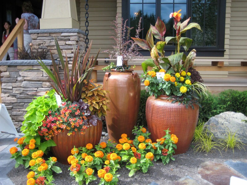 Large ceramic pots are planted with vibrant long lasting plants to created potted gardens for commercial and residential spaces in Seattle.