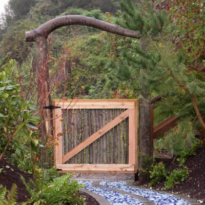 Unique and contemporary garden gate leads to a mediation garden in Seattle residence created by Lifestyle Landscapes.